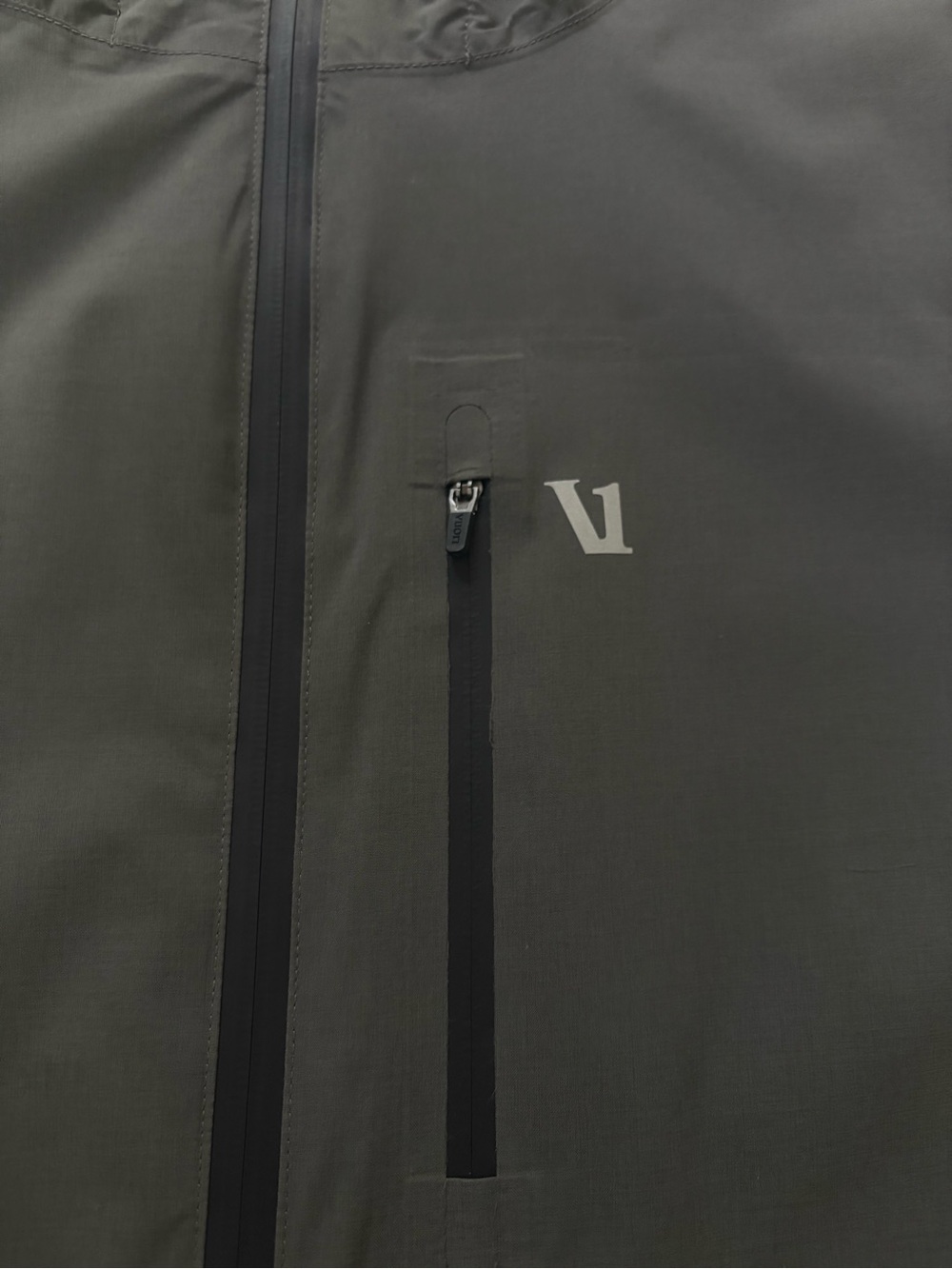Vuori Oahu Rain Jacket. Two-Tone Hooded Rain Jacket in Dark Gray and Black - Picture 5 of 9